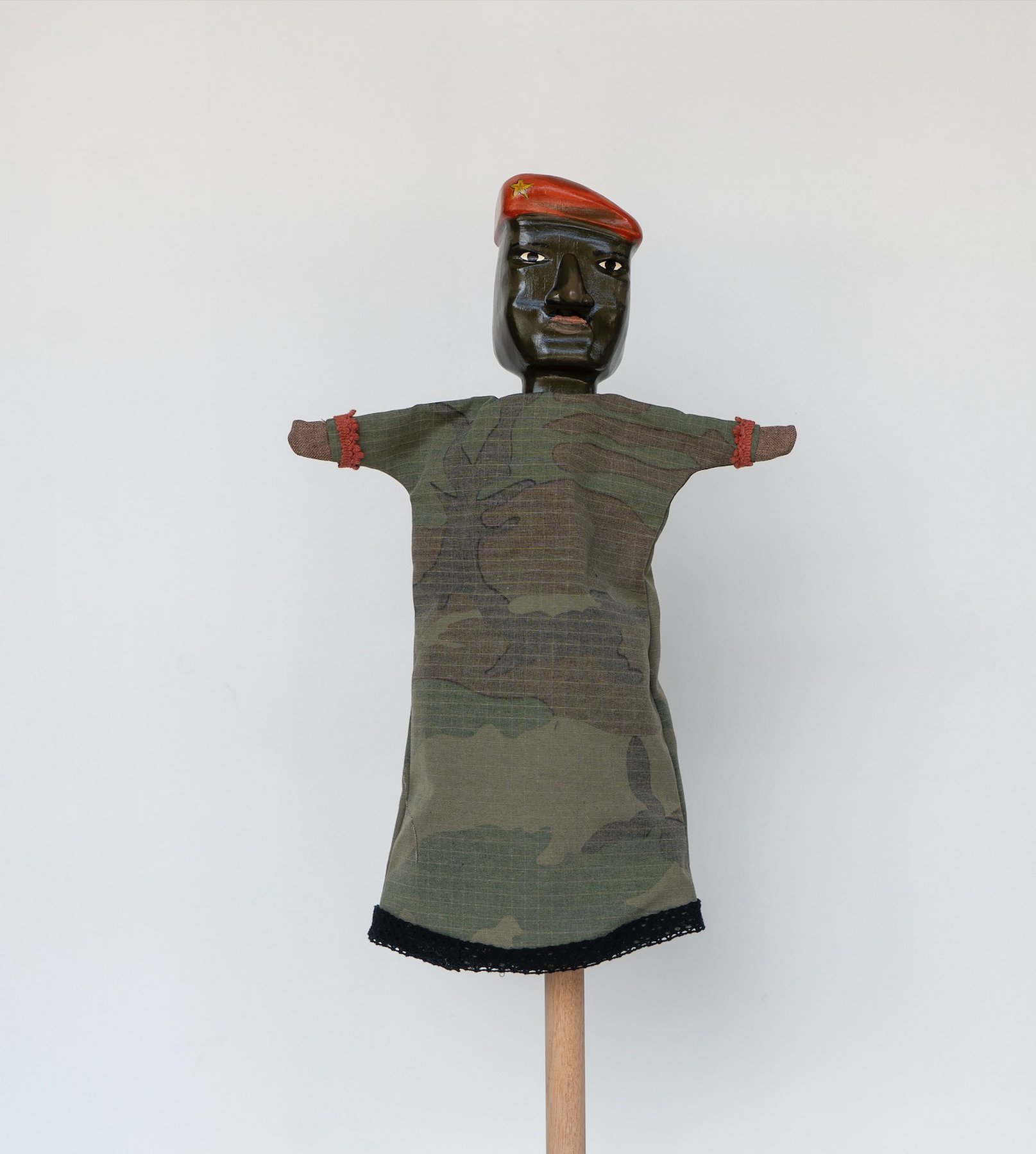 Daniela Ortiz, The Brightness of Greedy Europe, 2022, wood hand-carved, sewn, knitted and embroidered costumes (25 cm) puppet - Thomas Sankara