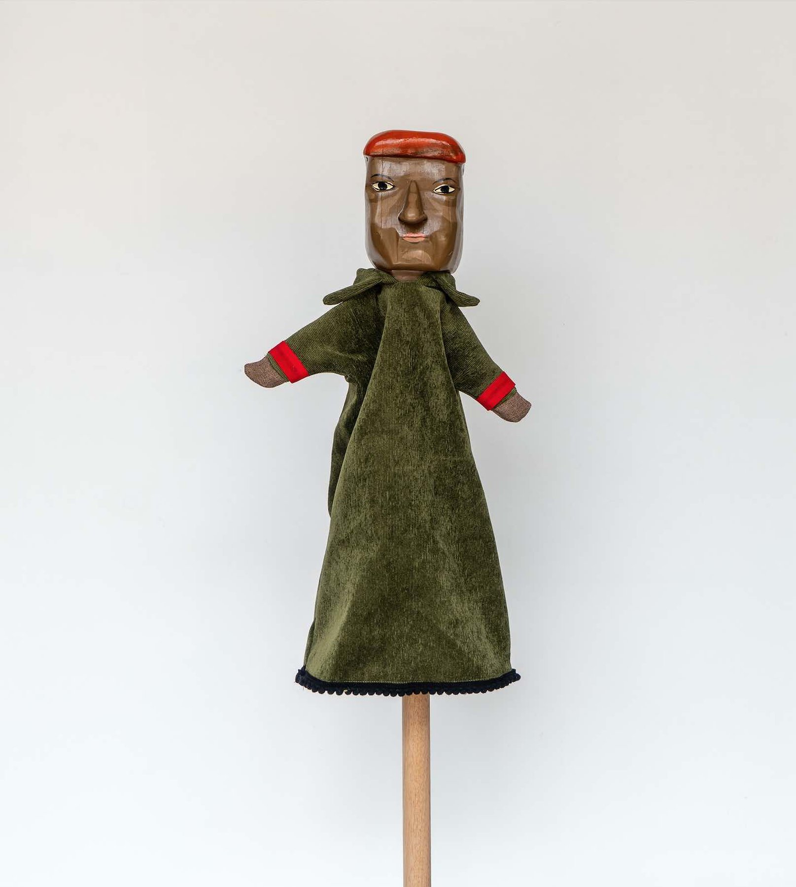 Daniela Ortiz, The Brightness of Greedy Europe, 2022, wood hand-carved, sewn, knitted and embroidered costumes (25 cm) puppet - Hugo Chávez