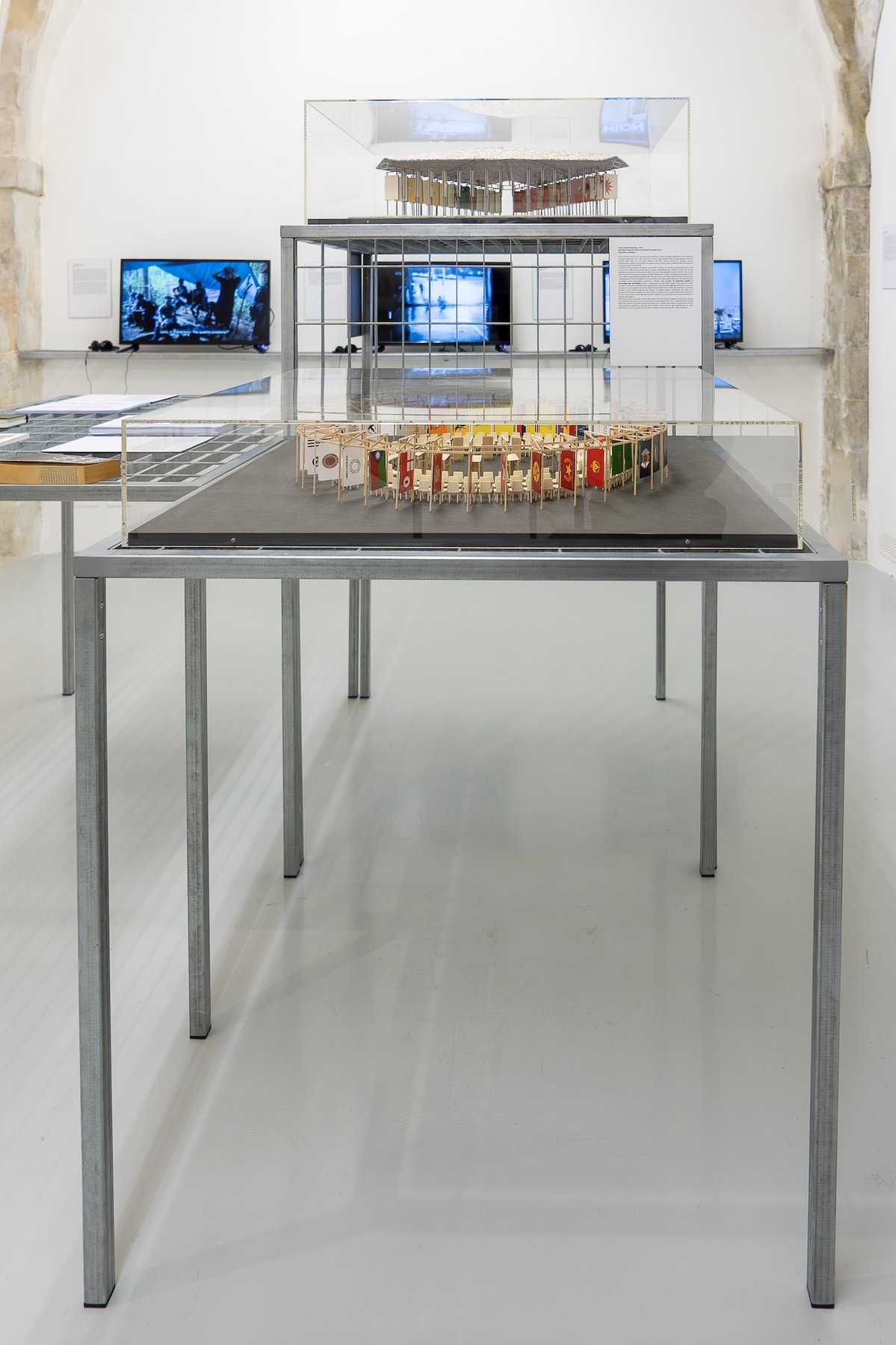 Installation view, Jonas Staal, New World Summit - Berlin, 2012 (down) and Kochi, 2013 (up), courtesy the artist and Laveronica gallery